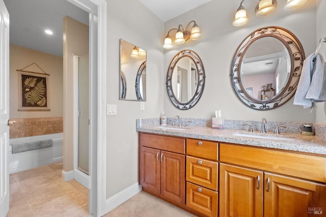 full bathroom with a shower with door, double vanity, a sink, and tile patterned floors