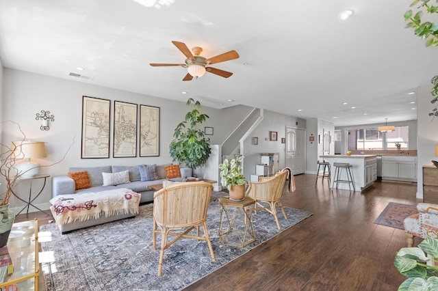 living area featuring stairs, wood finished floors, recessed lighting, and a ceiling fan