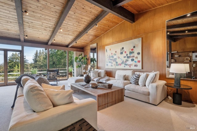 carpeted living room with wood ceiling, plenty of natural light, and wooden walls