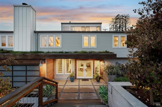 rear view of property with french doors