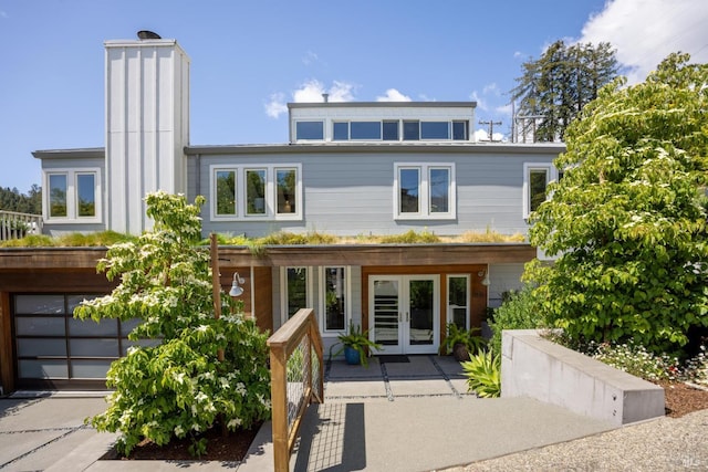 35 Bernard St, Mill Valley, CA 94941 - view of front of home with french doors, a garage, and a chimney