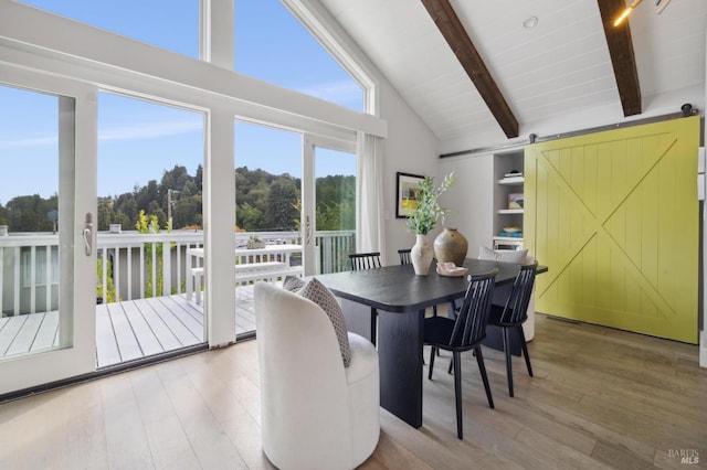 35 Bernard St, Mill Valley, CA 94941 - dining area with a barn door, high vaulted ceiling, wood finished floors, and beam ceiling