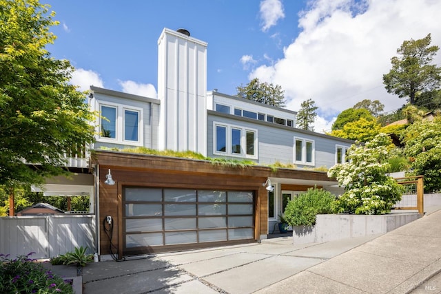 35 Bernard St, Mill Valley, CA 94941 - view of front facade featuring an attached garage, fence, driveway, and a chimney
