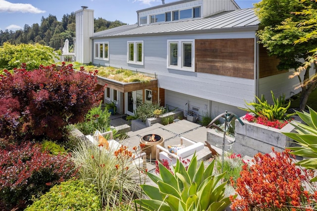 35 Bernard St, Mill Valley, CA 94941 - rear view of property featuring a fire pit, a standing seam roof, a patio area, and metal roof