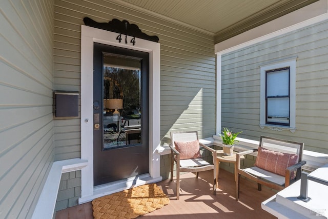 entrance to property featuring a porch