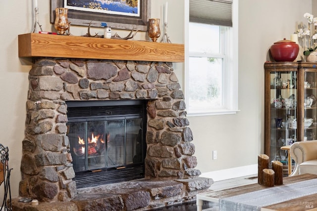 room details featuring a stone fireplace