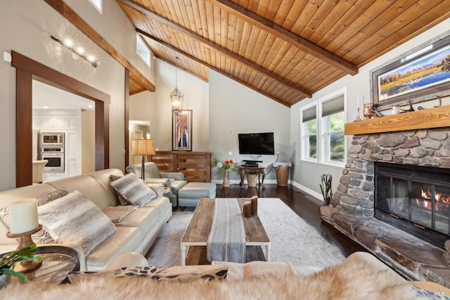 living area with wood ceiling, a fireplace, wood finished floors, baseboards, and beamed ceiling