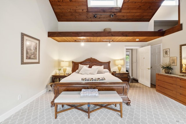 bedroom featuring baseboards, vaulted ceiling with beams, wooden ceiling, and light carpet