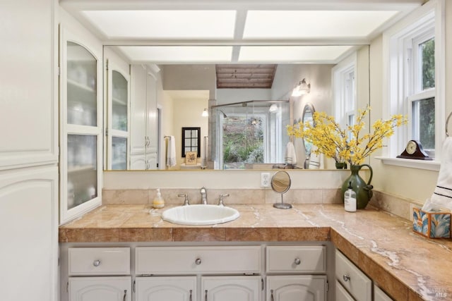 bathroom featuring vanity and a stall shower