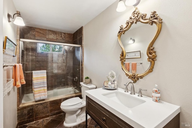full bath with toilet, vanity, and tiled shower / bath