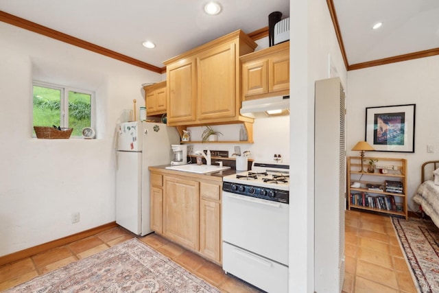 kitchen featuring crown molding, white appliances, under cabinet range hood, a sink, and light brown cabinets
