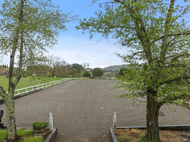 water view featuring a rural view and an enclosed area