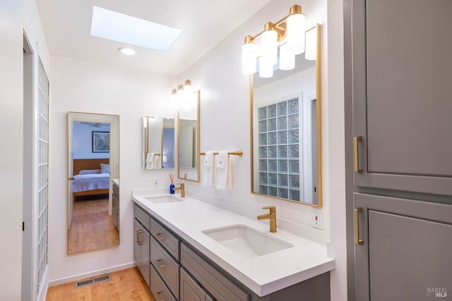 1777 Adams St, Saint Helena, CA 94574 - ensuite bathroom with a skylight, wood finished floors, a sink, and visible vents