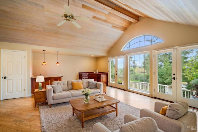 living room featuring french doors, high vaulted ceiling, light wood-style floors, beamed ceiling, and a ceiling fan