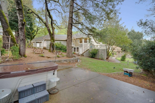 exterior space with a yard and stairs