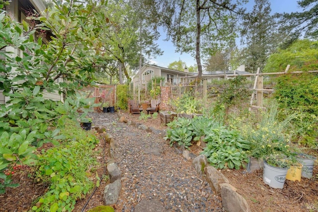 view of yard featuring a garden and fence