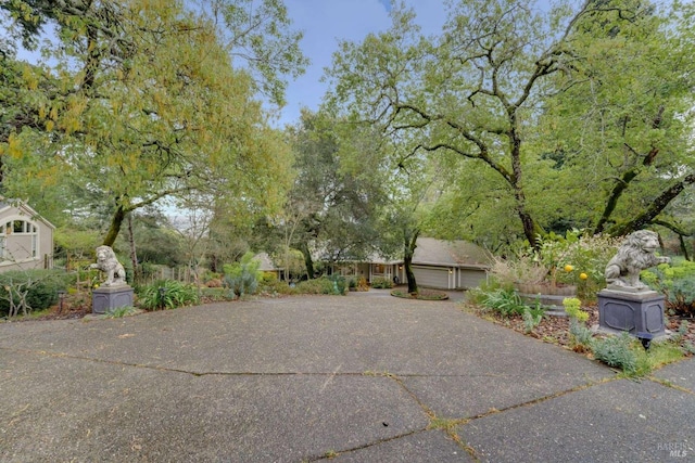 view of patio with a detached garage