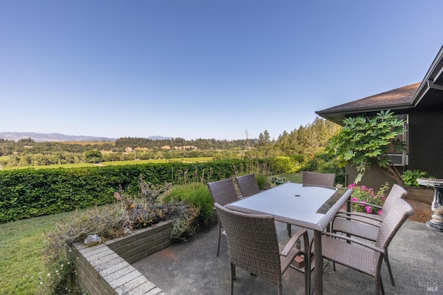view of patio featuring outdoor dining area