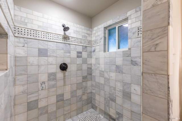 bathroom with a tile shower
