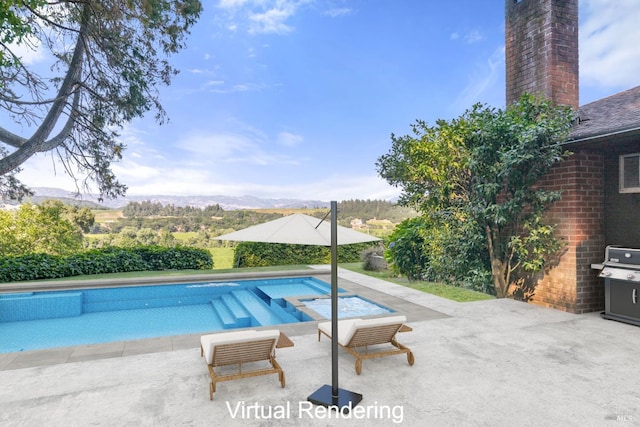 outdoor pool with a mountain view, a patio area, and area for grilling