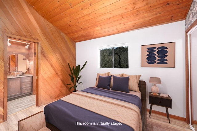 bedroom featuring wood ceiling, vaulted ceiling, wooden walls, and light wood-style flooring