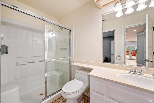 ensuite bathroom with toilet, ensuite bath, a shower stall, and vanity