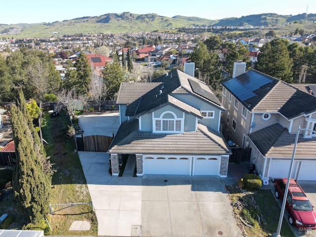 birds eye view of property with a residential view and a mountain view
