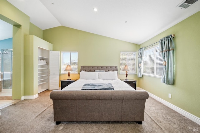 carpeted bedroom with visible vents, baseboards, and lofted ceiling