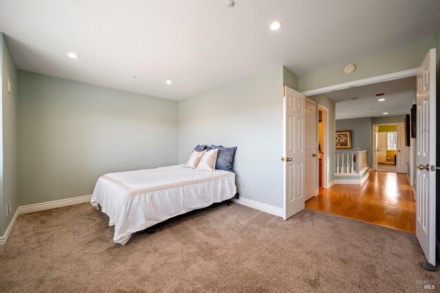 bedroom with carpet floors, recessed lighting, and baseboards