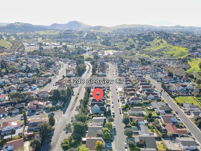 birds eye view of property with a residential view and a mountain view