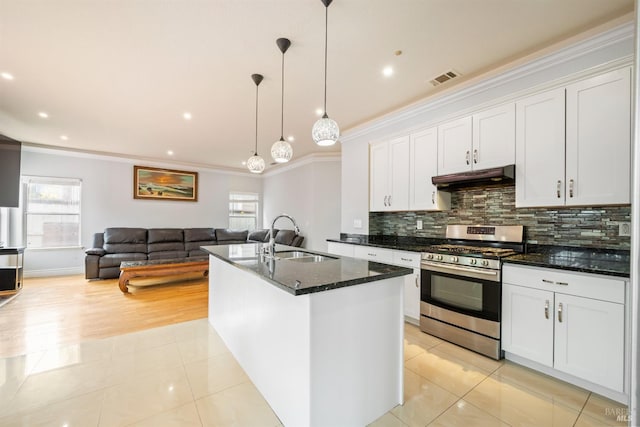 kitchen with visible vents, gas stove, a sink, ornamental molding, and under cabinet range hood