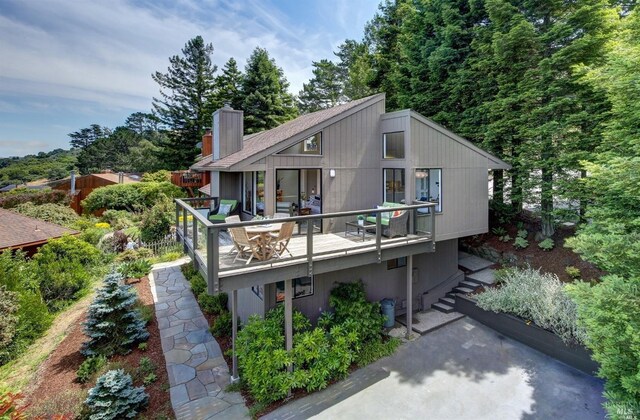 exterior space with a chimney and a deck