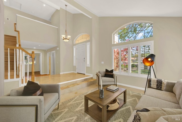 living room featuring stairway, an inviting chandelier, high vaulted ceiling, baseboards, and tile patterned floors
