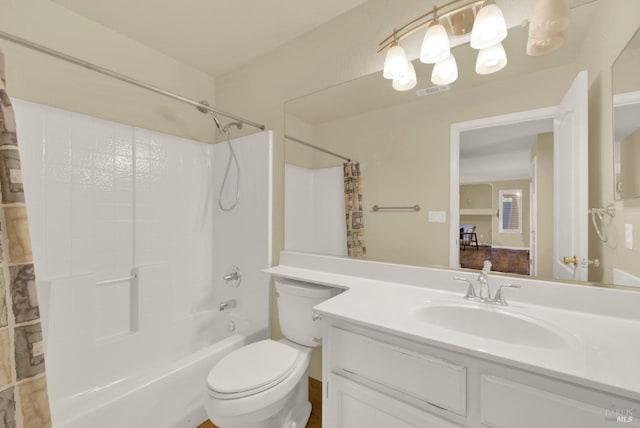 full bathroom featuring toilet, vanity, shower / bath combo, and visible vents