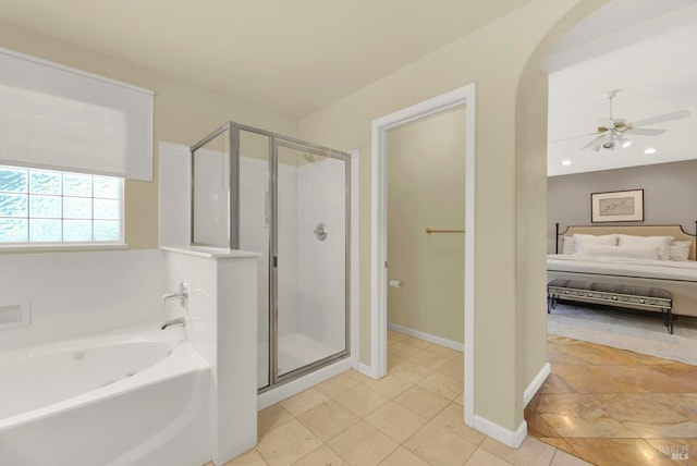 ensuite bathroom featuring connected bathroom, a stall shower, a bath, and a ceiling fan
