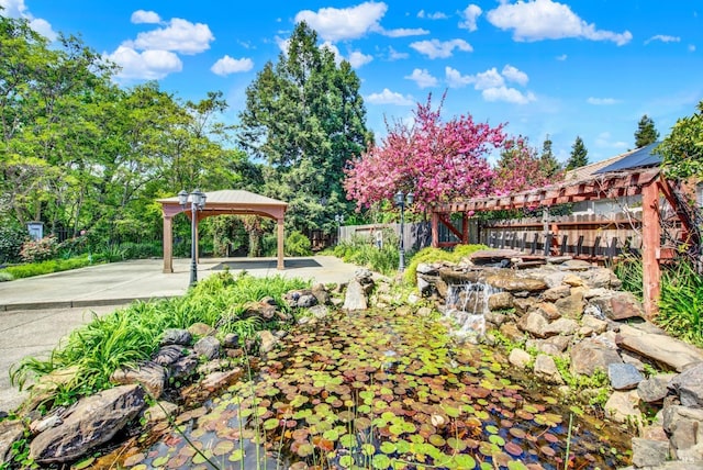 view of yard with a gazebo and fence