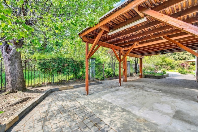 view of patio / terrace featuring fence