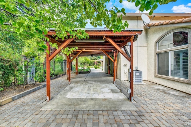view of patio / terrace with central AC unit and fence