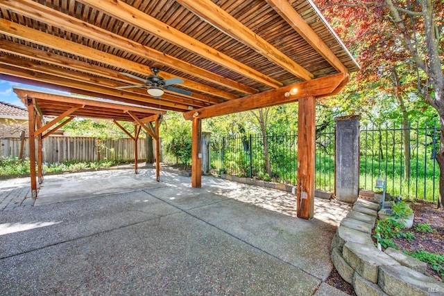 view of patio with a fenced backyard and a ceiling fan