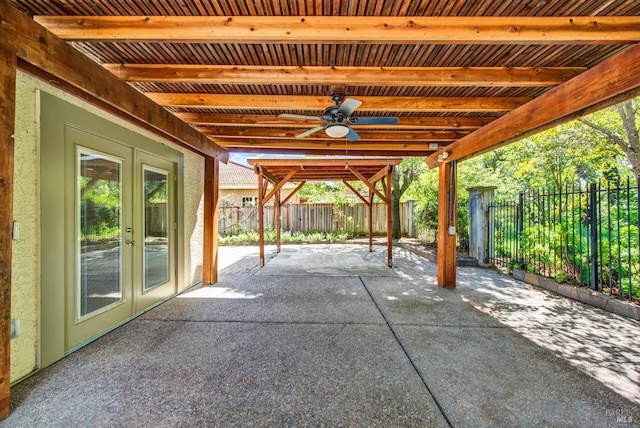 view of patio / terrace with a fenced backyard, ceiling fan, and french doors