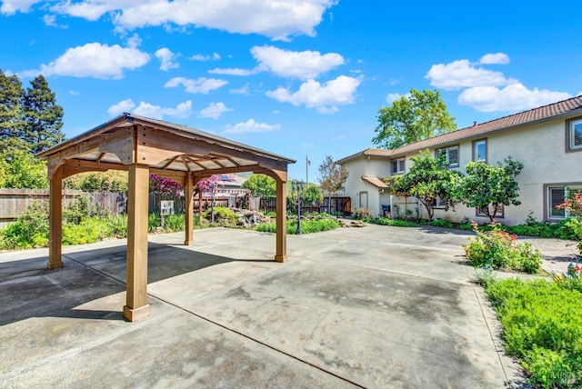 surrounding community featuring a patio area and fence