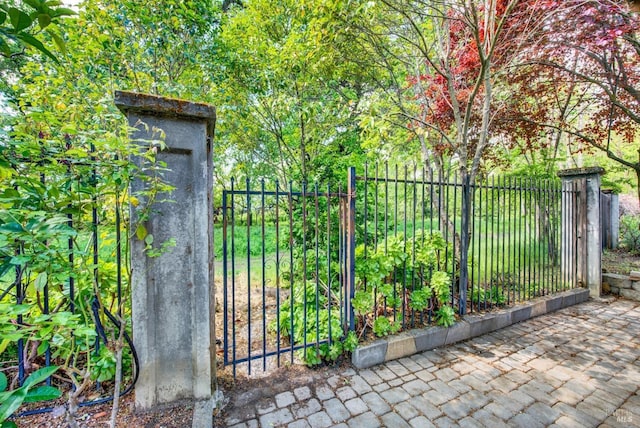 view of gate with fence