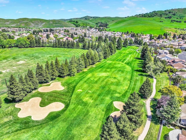 birds eye view of property with a mountain view