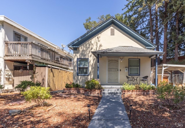 view of front of property with stucco siding and covered porch