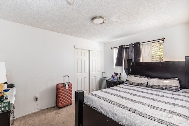 bedroom with light carpet, a closet, and a textured ceiling