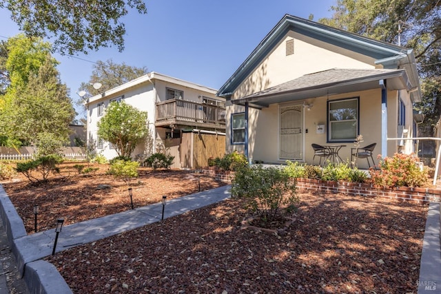 view of front of house featuring a porch and stucco siding