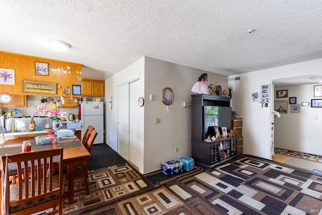 dining room featuring visible vents and a textured ceiling