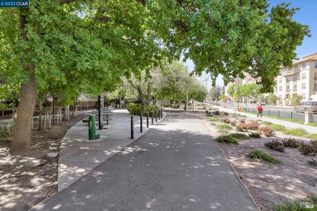 view of community with fence