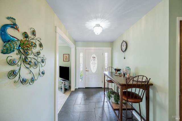 foyer entrance with stone tile flooring