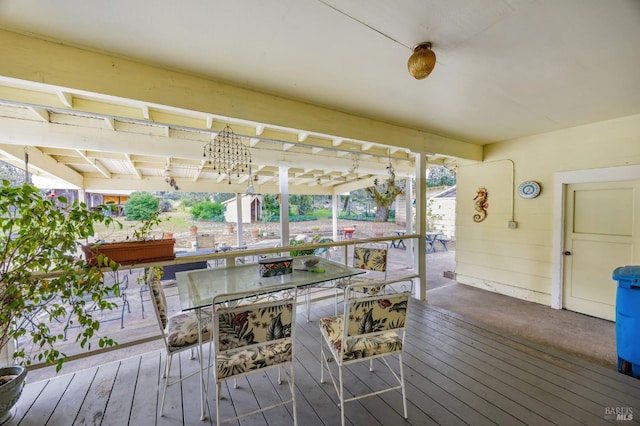 wooden terrace featuring outdoor dining space